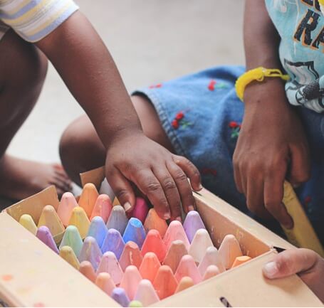 kids opening a box of chalk