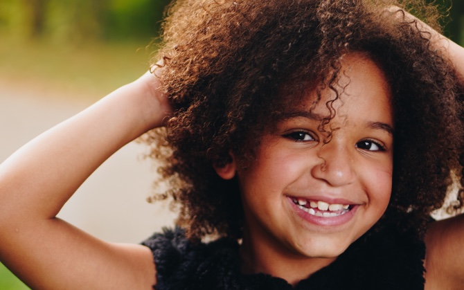 female kid smiling bif for camera